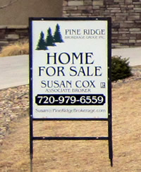 Pine Ridge Brokerage for sale sign in yard